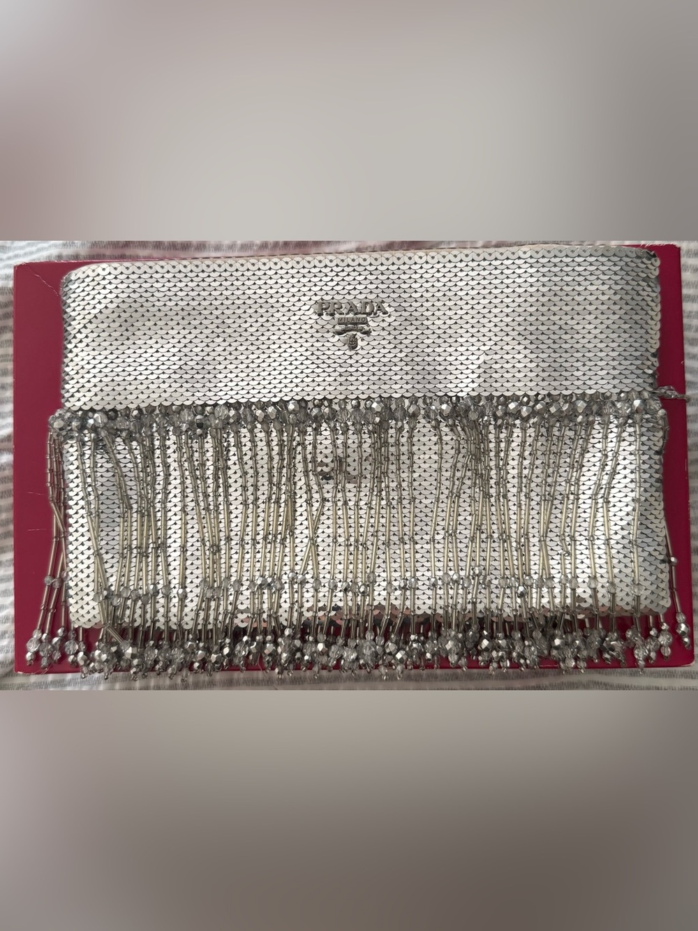 Prada Silver Luxury Clutch
Used once only,Perfect for weddings & special events